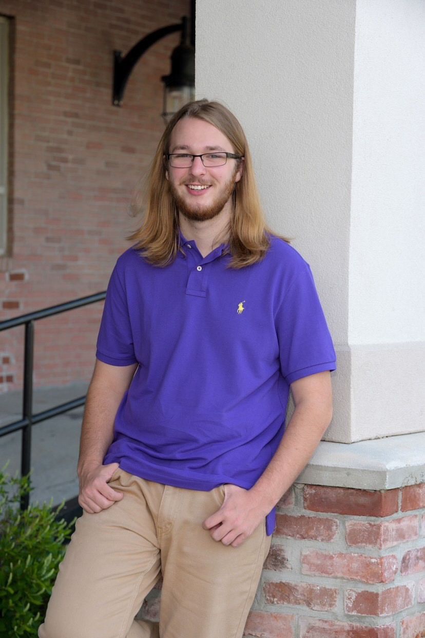 Anderson Dallaire standing, scholarship winner